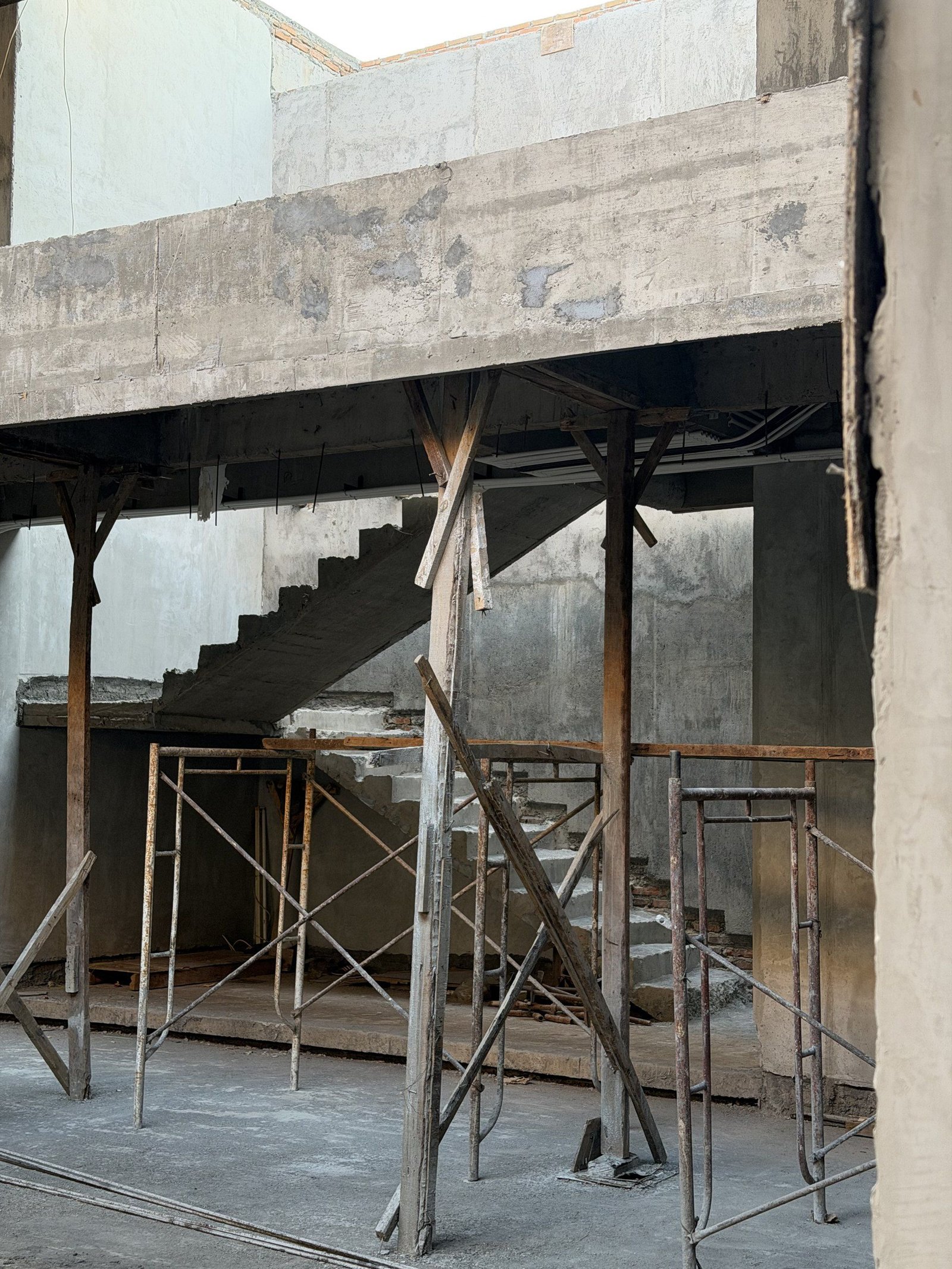 Living room and stair, Site · October 2026